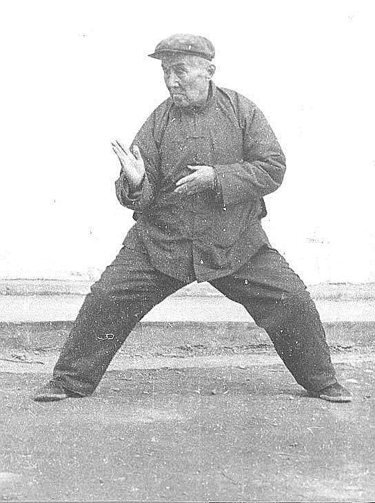 Hong Junsheng practicing, horse stance with hands in warding posture